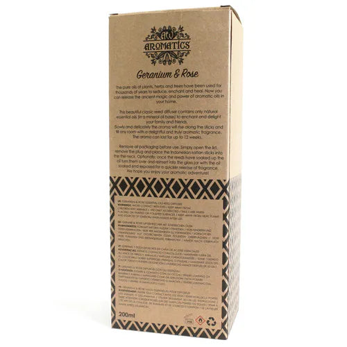 A detailed view of the back of a brown cardboard box for a "Geranium & Rose" reed diffuser. The box shows a product description, instructions for use, and safety warnings printed in multiple languages.