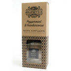 A brown cardboard box for a "Peppermint & Frankincense" reed diffuser, standing upright on a white background. The box has a window that reveals the square glass bottle inside.