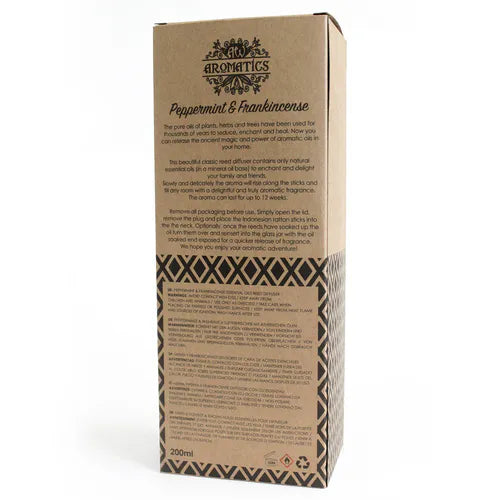A detailed close-up of the back of a brown cardboard box for a "Peppermint & Frankincense" reed diffuser. The box shows a product description, instructions for use, and safety warnings printed in multiple languages.