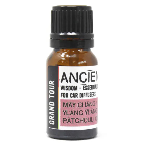 A crisp product shot of a single bottle of Ancient Wisdom "Grand Tour" essential oil. The bottle contains an aromatherapy blend of "May Chang, Ylang Ylang, Patchouli," offering a unique and exotic home fragrance for your vehicle.