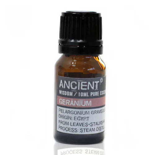 Amber glass bottle of Ancient Wisdom geranium essential oil, labeled with origin from Egypt and details about steam distillation from leaves and stalks.