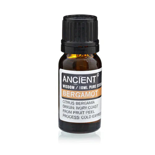 Amber glass bottle of Ancient Wisdom bergamot essential oil, labeled with Citrus bergamia, origin Ivory Coast, extracted from fruit peel by cold expression.