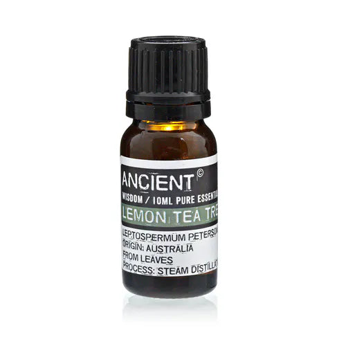 Amber glass bottle of Ancient Wisdom lemon tea tree essential oil, labeled with Leptospermum petersonii, origin Australia, extracted from leaves by steam distillation.