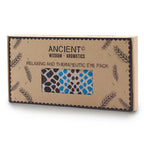 A product image of a brown cardboard gift box containing an aromatherapy eye pillow. The box has a window showing a blue and black spotted fabric, perfect for a relaxing home fragrance and aromatherapy session.