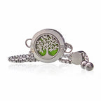 Stainless steel aromatherapy bracelet with tree of life design, green felt insert.