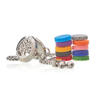 Stainless steel aromatherapy bracelet with tree of life design, shown with colorful felt pads.
