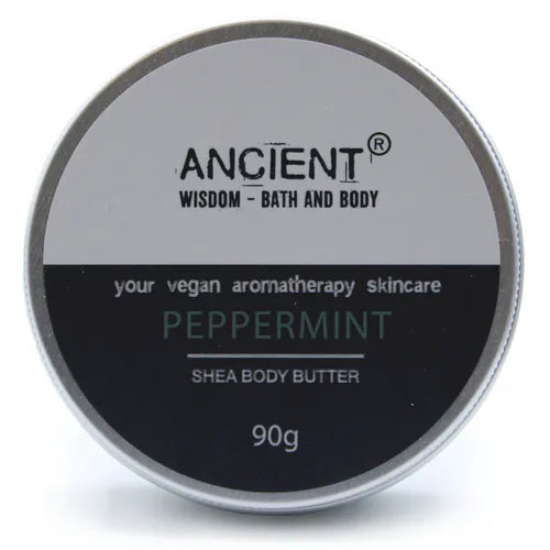 Round silver tin container of Ancient Wisdom Shea Body Butter, labeled “Peppermint”, vegan aromatherapy skincare, 90g.