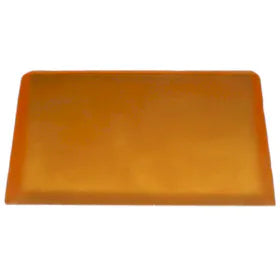 Orange rectangular essential oil soap bar with smooth surface, slightly translucent and evenly shaped.