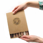 Person holding a cardboard box labeled "7 Days of Self Care Aromatherapy Bath Salts"