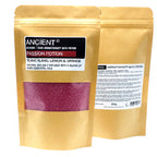 Brown kraft pouch of Ancient Wisdom Aromatherapy Bath Potion labeled “Passion Potion” with Ylang Ylang, Lemon & Orange essential oils, showing the front label and transparent window filled with pink bath salts, alongside the back of the package with ingredient details.