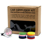 Complete car diffuser kit including a silver tree of life diffuser with pink felt insert, a set of colorful round fragrance felt pads (yellow, green, pink, blue, purple, black, gray, red, and orange), and eco-friendly brown packaging box with printed instructions and product description.