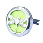 Car diffuser in polished stainless steel with a silver dragonfly design. Features a lime green felt insert that absorbs essential oils, transforming the car interior into a fresh and fragrant environment with a touch of natural elegance.