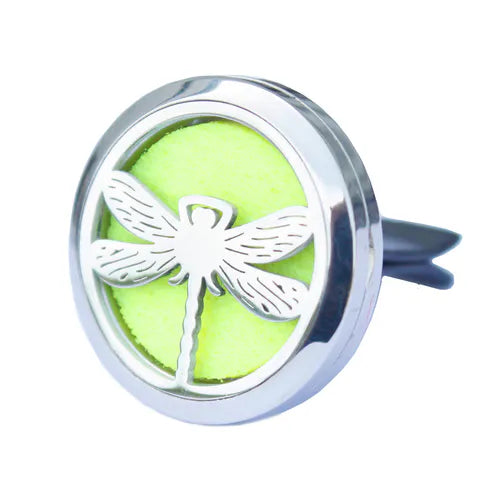 Car diffuser in polished stainless steel with a silver dragonfly design. Features a lime green felt insert that absorbs essential oils, transforming the car interior into a fresh and fragrant environment with a touch of natural elegance.
