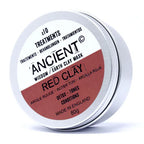 Close-up of Ancient Wisdom Red Clay Mask tin container, labeled “Red Clay” with detox, tone, and condition benefits. The minimalist silver packaging with earthy red label emphasizes natural skincare, promoting wellness and purity.