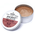 Open Ancient Wisdom Red Clay Mask tin showing fine red clay powder inside. The eco-friendly silver container with detailed labeling highlights detoxifying and toning properties, appealing to consumers seeking natural, revitalizing skincare treatments.