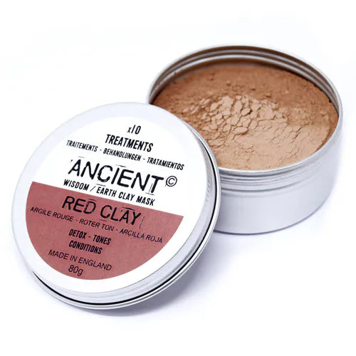 Open Ancient Wisdom Red Clay Mask tin showing fine red clay powder inside. The eco-friendly silver container with detailed labeling highlights detoxifying and toning properties, appealing to consumers seeking natural, revitalizing skincare treatments.