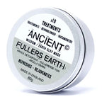 Tin of Ancient Wisdom Earth Clay Mask, labeled "Fullers Earth," 80g. The silver container has a white and pale green label that highlights its detoxifying, refreshing, and rejuvenating properties. Text is presented in multiple languages.