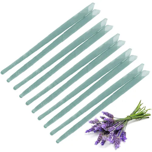 Set of multiple green ear candles arranged in parallel rows, displayed with a small bundle of lavender flowers in the corner to represent lavender aroma.