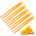 Set of multiple orange ear candles arranged in a row, accompanied by fresh orange slices in the corner, symbolizing citrus fragrance.