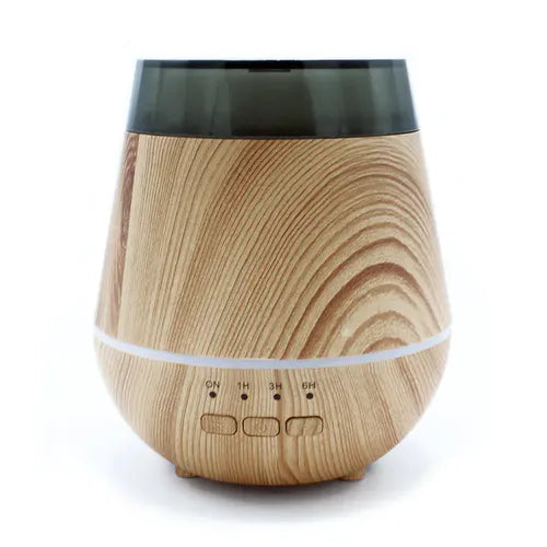 Front view of a wood grain aroma diffuser with a rounded, modern design, a dark semi-transparent top lid, and four small buttons labeled ON, 1H, 3H, and 6H at the base.