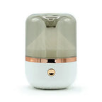 Close-up front view of a white round mirror aromatherapy humidifier with a transparent top and rose gold accent.