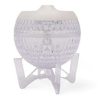 Transparent faceted spherical aroma diffuser with a white lid, placed on a clear tripod stand, turned off.