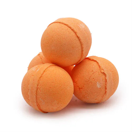 Set of four bright orange bath bombs arranged in a small pyramid, each with a slightly rough surface and distinct seam line, photographed against a plain white background.