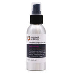A 100ml aluminum spray bottle of "Ancient Wisdom Aromatherapy Mist Patchouli" with a black spray nozzle and white label featuring purple and black text, placed against a plain white background.
