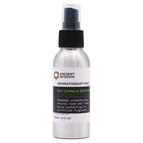 Close-up of an aluminum spray bottle labeled “Ancient Wisdom Aromatherapy Mist – May Chang & Bergamot.” The 100ml (3.5 fl oz) bottle features a white label with black and green text, a black spray cap, and sits against a plain white background.