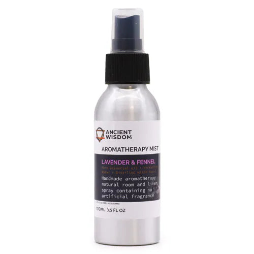 A silver aluminum spray bottle labeled "Ancient Wisdom Aromatherapy Mist – Lavender & Fennel." The label specifies it is handmade aromatherapy, a natural room and linen spray with no artificial fragrance, containing pure essential oil, Yorkshire water, and distilled witch hazel. The bottle has a black spray nozzle and stands upright against a plain white background, emphasizing the clean and minimalistic packaging design.