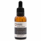 Ancient Wisdom Facial Serum Daily Glow – amber glass bottle with dropper cap, hydrates and protects skin, 30ml.
