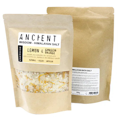 Brown kraft pouch of Ancient Wisdom Himalayan Bath Salt Lemon, Ginger & Orange, energising artisan blend with essential oils, avocado oil, and marigold flowers; salt with vibrant yellow-orange petals visible.