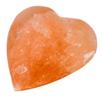 Heart-shaped Himalayan pink salt deodorant stone isolated on white background.