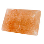 Rectangular Himalayan pink salt deodorant stone isolated on white background.
