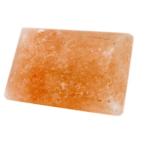 Rectangular Himalayan pink salt deodorant stone isolated on white background.