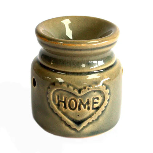 Brown glazed ceramic oil burner with a rounded top bowl for holding essential oils or wax melts, featuring a raised heart-shaped design on the front with the word “HOME” embossed inside the heart.