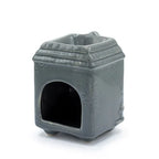 Rear view of the grey ceramic house-shaped oil burner, showing a large arched opening at the back for inserting a tealight candle.