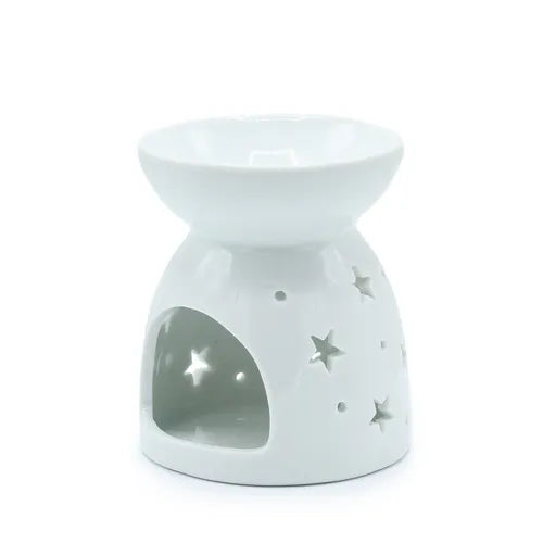 Rear view of white ceramic oil burner with a glossy finish, featuring a rounded bowl-shaped dish on top and a conical base. The base has several star-shaped and circular cutouts, along with a large arched opening in the front for placing a tealight candle. The polished surface reflects light, emphasizing its smooth texture.