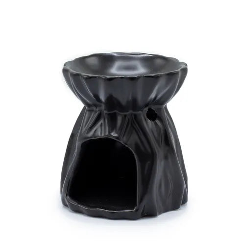 Black ceramic oil burner designed with a draped fabric-like texture, showing a wide open cutout at the base for placing a tealight candle. The top part has a wide bowl for oils or wax melts, while a small circular hole on the side provides ventilation.
