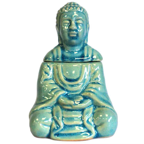 Complete turquoise ceramic oil burner shaped as a seated Buddha figure. The Buddha is shown with a serene facial expression and detailed robe patterns, finished with a glossy crackle glaze. The head serves as a removable lid for the tealight compartment.