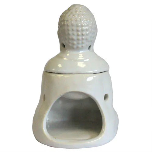 White ceramic oil burner shaped like a Buddha figure, photographed from the back. The removable Buddha head sits on top, with a hollow opening below for placing a tealight candle. The glossy finish reflects light on the surface.