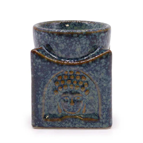 Artistic ceramic oil diffuser in blue mottled glaze with embossed Buddha face motif, designed for home fragrance, relaxation, and spiritual ambiance.