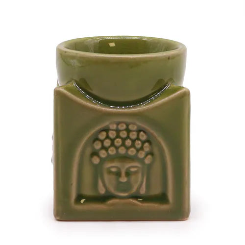 Front view of a green ceramic Buddha oil burner with embossed Buddha head motif, handcrafted design for aromatherapy, incense, and home spa ambiance.