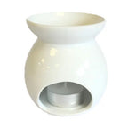 A simple and elegant white ceramic oil burner with a glossy finish. This classic aromatherapy diffuser has a minimalist design with a smooth, curved body and a wide, top-facing bowl for holding scented oils or wax. The base has a large, circular opening for inserting a tea light candle. This is a versatile and timeless piece of home decor, suitable for any interior style. The image is a clear, front-facing shot against a white background.