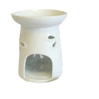 A decorative, white ceramic oil burner with a polished, shiny glaze. The cylindrical body of the burner is adorned with multiple intricate dragonfly cutouts, allowing light to shine through when a candle is placed inside. The design is perfect for adding a touch of natural beauty to any room. This versatile piece of home decor functions as an essential oil diffuser or wax melt warmer. Photographed against a pure white background.