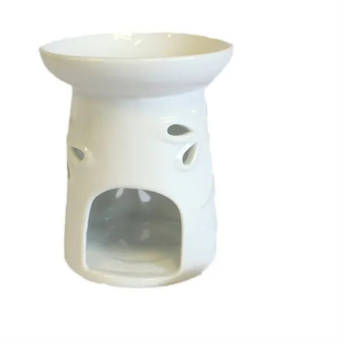 A decorative, white ceramic oil burner with a polished, shiny glaze. The cylindrical body of the burner is adorned with multiple intricate dragonfly cutouts, allowing light to shine through when a candle is placed inside. The design is perfect for adding a touch of natural beauty to any room. This versatile piece of home decor functions as an essential oil diffuser or wax melt warmer. Photographed against a pure white background.