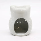 A full, back-facing product shot of a cute, white ceramic owl essential oil diffuser against a pure white background. The owl has a simplified, rounded shape with a glossy glaze. There is a large oval opening on the back for easy access to place a tea light candle. The top of the owl's head forms a deep dish for essential oils or wax melts. 