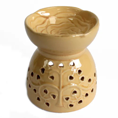 A beautiful, glossy beige ceramic essential oil burner and wax warmer. The top bowl features a detailed, raised rose design, while the base is decorated with a cutout tree of life pattern with heart-shaped leaves. This elegant and romantic piece of home decor is perfect for aromatherapy, home fragrance, and creating a calming ambiance. The product is photographed against a clean white background.