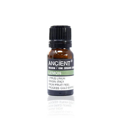 A small, 10ml amber glass bottle of Ancient Wisdom Organic Lemon essential oil. The bottle has a black cap and a black label with a light green band. The label lists product details including the Latin name, origin, and distillation process. The bottle is photographed against a clean white background.