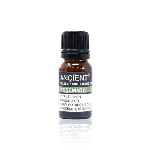 A small, 10ml amber glass bottle of Ancient Wisdom Organic Rosemary essential oil. The bottle has a black cap and a black label with a light green band. The label lists product details including the Latin name, origin, and distillation process. The bottle is photographed against a clean white background.